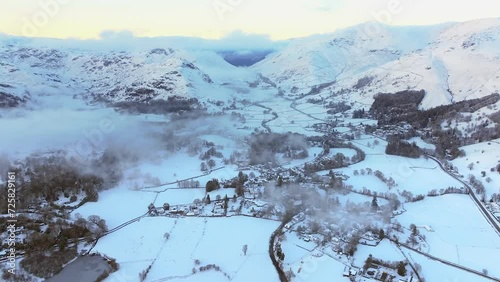 Aerial snow covered landscape around the famous village of Grasmere, Lake District National Park, Cumbria, England