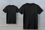 Two black shirts hanging on a wall. Suitable for fashion or clothing related projects