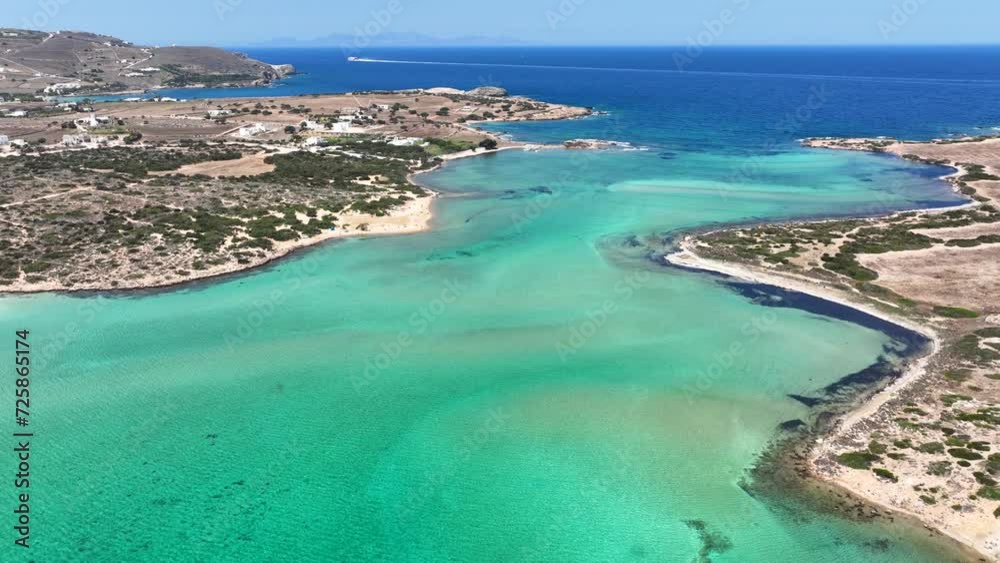 Aerial drone video of tropical paradise exotic island bay covered in limestone trees with emerald crystal clear beach visited by luxury yachts and sail boats in Caribbean destination Aerial drone video of tropical paradise exotic island bay covered in limestone trees with emerald crystal clear beach visited by luxury yachts and sail boats in Caribbean destination