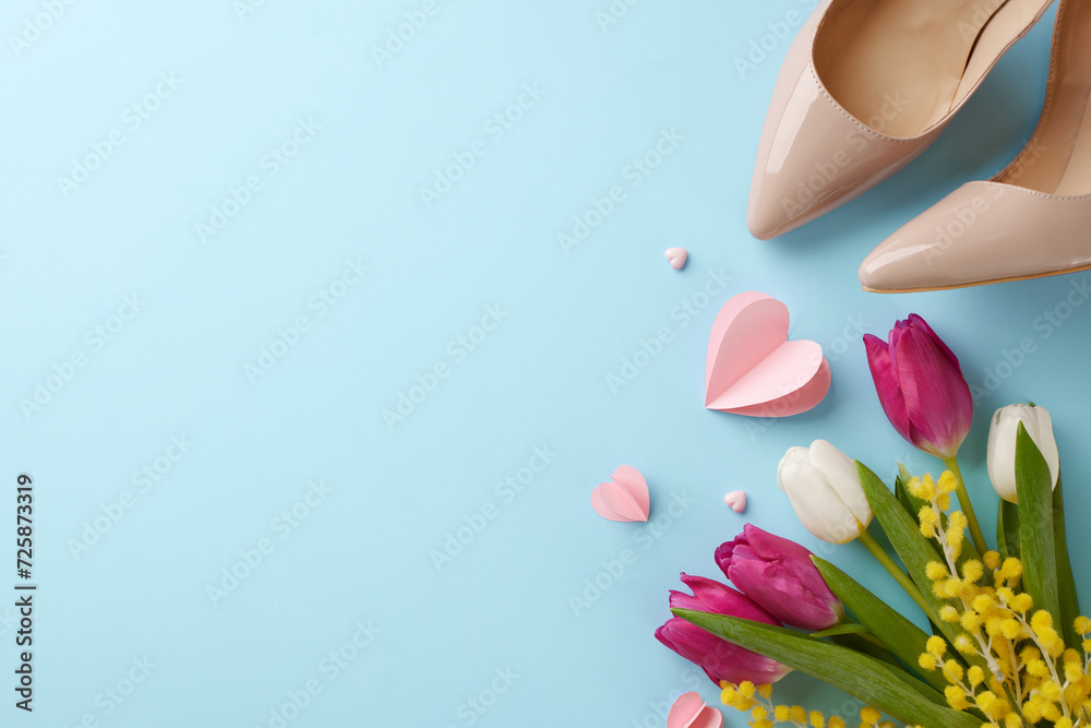 Elegance in empowerment: a toast to Women's Day with style and grace. Top view photo of heels, hearts, tulips, mimosa on pastel blue background with space for festive text
