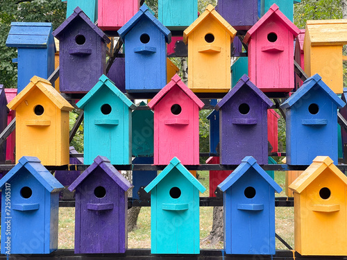 Lots of colorful birdhouse in the woods for the birds © pridannikov