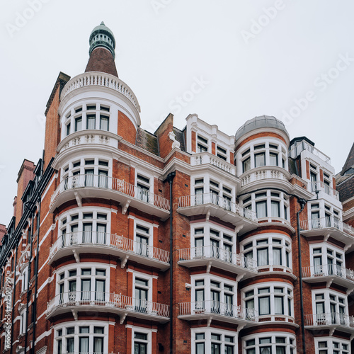 Traditional red brick apartment block in Kensington and Chelsea, London, UK. photo