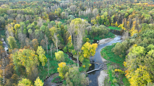 Autumn river delta floodplain fall color meander drone aerial inland video shot in sandy sand alluvium, benches forest and lowlands wetland swamp, quadcopter view flying fly flight show photo