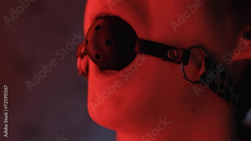 Man's mouth covered with a gag, close-up photo