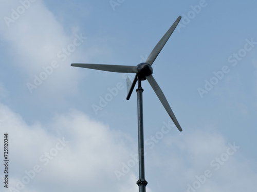 Windmill turbine wind technology environment electricity generator farm energy power alternative ecology farm sustainable esg fund innovation agriculture field resource blue sky background copy space 
