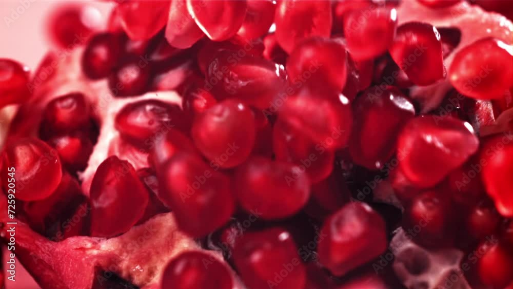 Pomegranate seeds fall on a piece. Filmed on a high-speed camera at 1000 fps. High quality FullHD footage Pomegranate seeds fall on a piece. Filmed on a high-speed camera at 1000 fps. High quality FullHD footage