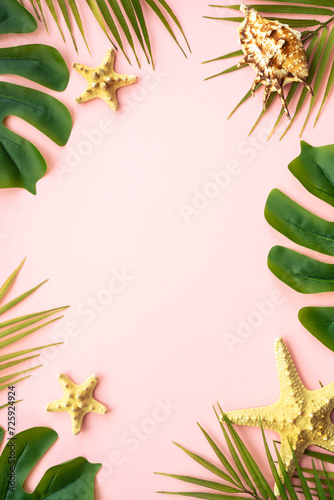 Summer flat lay background. Tropical leaves, palm leaves and sea shells on white background.