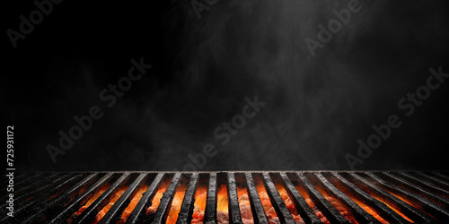 Hot orange flames and smoke rise from a charcoal grill, ready for barbecuing.	
 photo