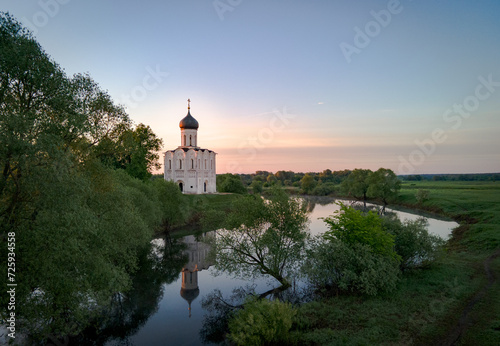 Church of the Intercession on the Nerl. Orthodox church on a spring morning at dawn photo