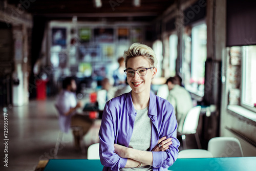 Portrait of a young woman working in a startup company office