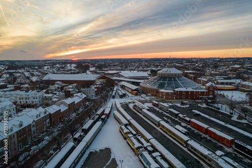 Drone View of Baltimore City Houses with Snow Covered Roofs at Sunset