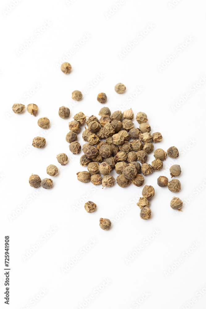Green peppercorns on white background. Organic spice. Dry green pepper grain. Green peppercorns on white background. Organic spice. Dry green pepper grain.