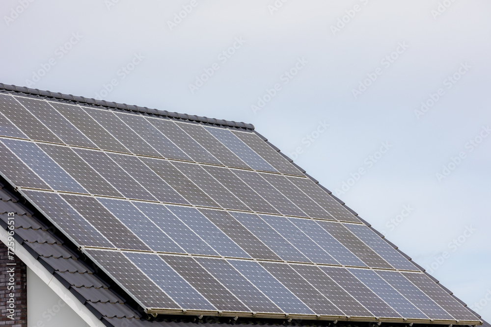 Green energy concept, Solar cell panel on the rooftop with cloudy sky, Photovoltaic cell is an electrical device that converts the energy of light directly into electricity by the photovoltaic effect. Green energy concept, Solar cell panel on the rooftop with cloudy sky, Photovoltaic cell is an electrical device that converts the energy of light directly into electricity by the photovoltaic effect.