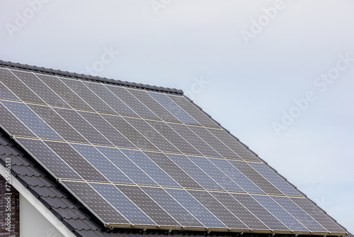 Wallpaper Mural Green energy concept, Solar cell panel on the rooftop with cloudy sky, Photovoltaic cell is an electrical device that converts the energy of light directly into electricity by the photovoltaic effect. Torontodigital.ca