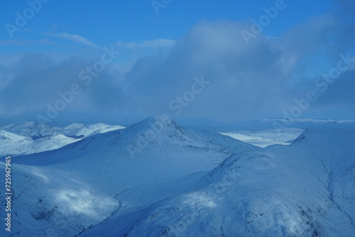 Aerial photo of snow-capped hills © TheFlyingMeerkat