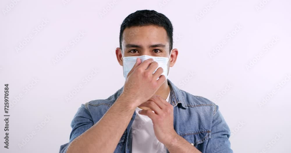 Man, mask and heart in studio, face and protocol in emergency by white background. Asian male person, protection and portrait by mockup, love emoji and prevention of bacteria and disease or virus Man, mask and heart in studio, face and protocol in emergency by white background. Asian male person, protection and portrait by mockup, love emoji and prevention of bacteria and disease or virus