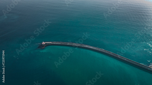 Aerial view of lighthouse in blue waters of Newhaven, East Sussex, UK © Pavel