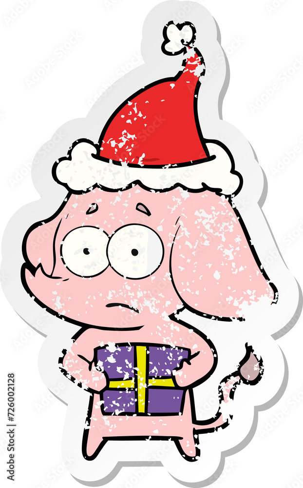 distressed sticker cartoon of a unsure elephant with christmas present wearing santa hat distressed sticker cartoon of a unsure elephant with christmas present wearing santa hat