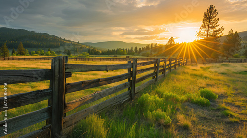 Picturesque landscape of a fenced ranch at sunrise - photo