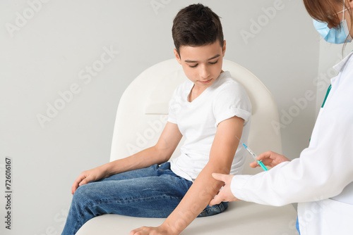 Little boy receiving vaccin...