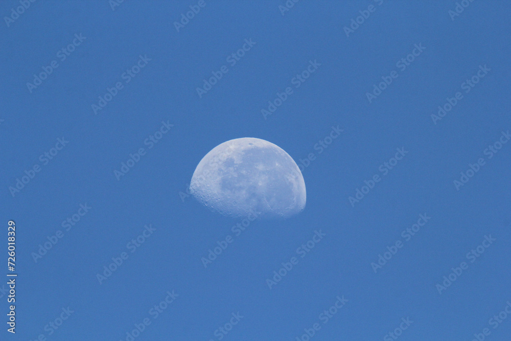 Close up of the moon against a blue sky Close up of the moon against a blue sky