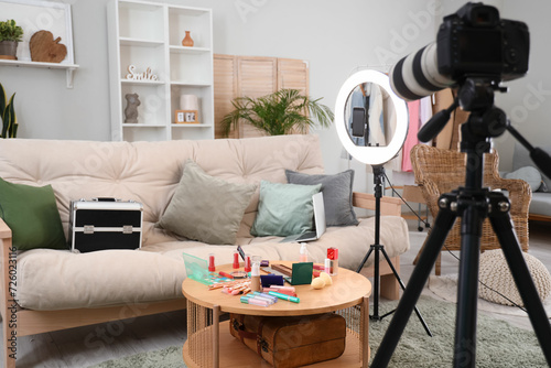 Interior of beauty blogger's living room with makeup products and equipment