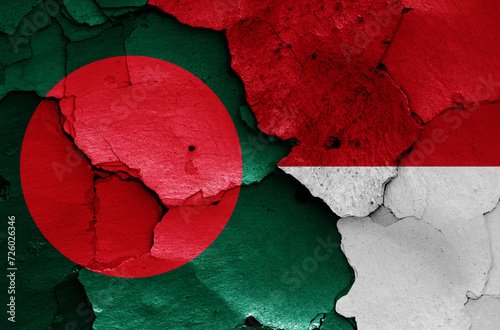 flags of Bangladesh and Indonesia painted on cracked wall