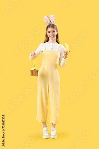 Young woman in bunny ears w...