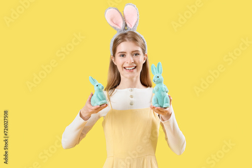 Young woman in bunny ears w...