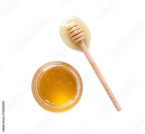 Tasty honey in glass jar and dipper on white background, top view. Space for text