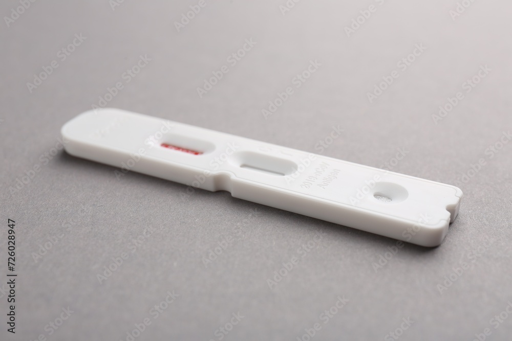 Disposable express test on grey background, closeup Disposable express test on grey background, closeup