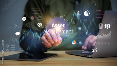 Asset management concept, Businessman Holding asset management and Icon  on virtual display. Financial Property Digital assets. photo