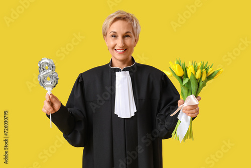 Mature female judge with tu...