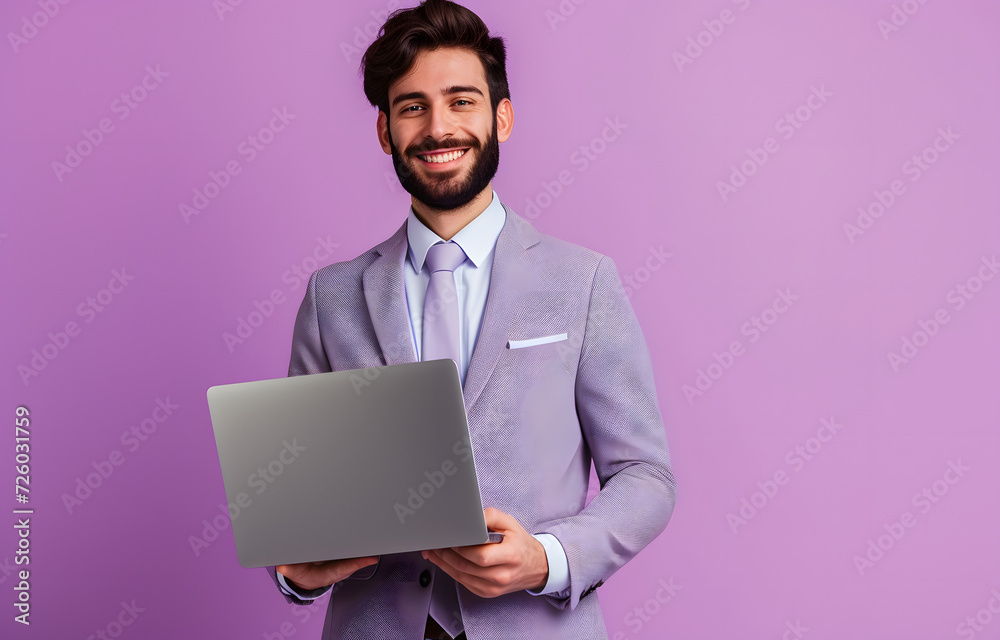attractive man in a suit holding laptop attractive man in a suit holding laptop