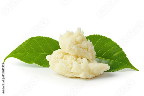 Green leaf with shea butter on white background