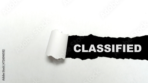 Ripped paper with classified text