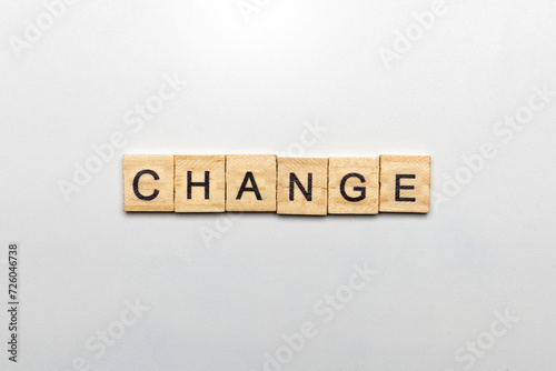 A row of wooden cubes with change text