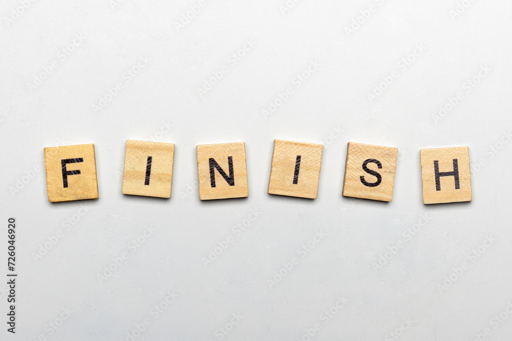 A row of wooden cubes with finish text A row of wooden cubes with finish text
