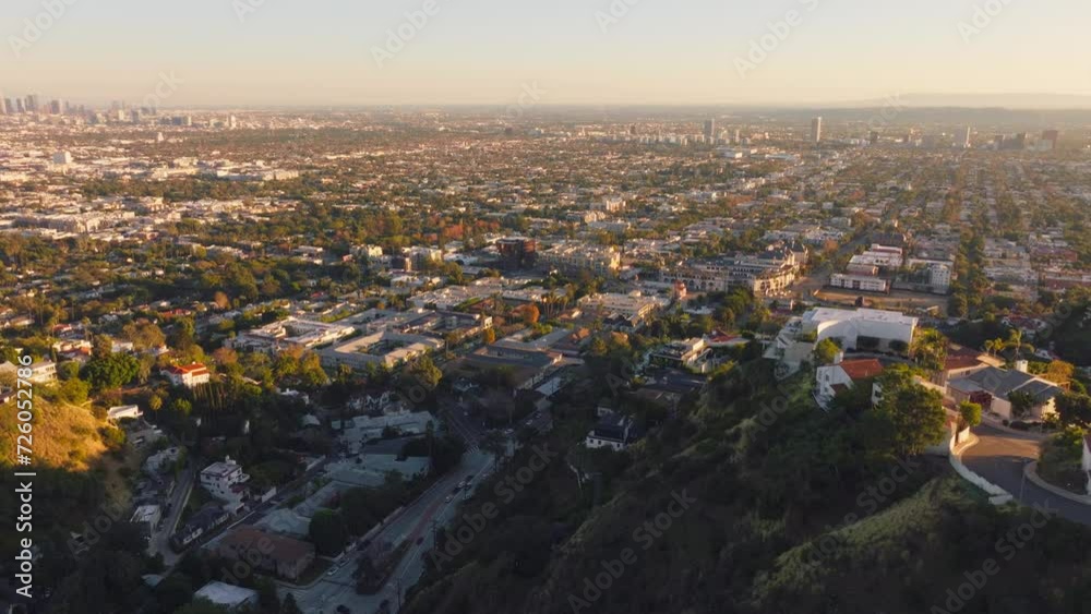 Flying Over Hollywood, Pulling Back To Reveal Sunlit City Condos and Luxury Homes in the Hills
