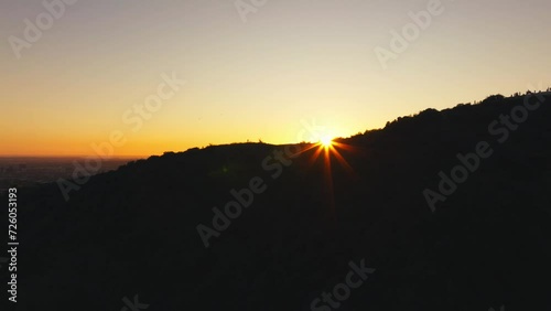 Sun Peering Through Mountains at Runyon Canyon, Hollywood Hills Trail as Seen By Drone photo