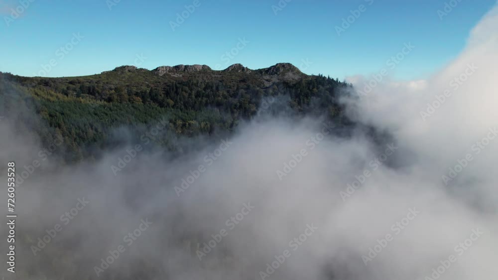 drone shot going forward revealing the pic des 3 dents above the clouds in le Pilat Natural Regional Park near Saint Etienne in Loire departement, Auvergne rhone alpes region in french countryside drone shot going forward revealing the pic des 3 dents above the clouds in le Pilat Natural Regional Park near Saint Etienne in Loire departement, Auvergne rhone alpes region in french countryside