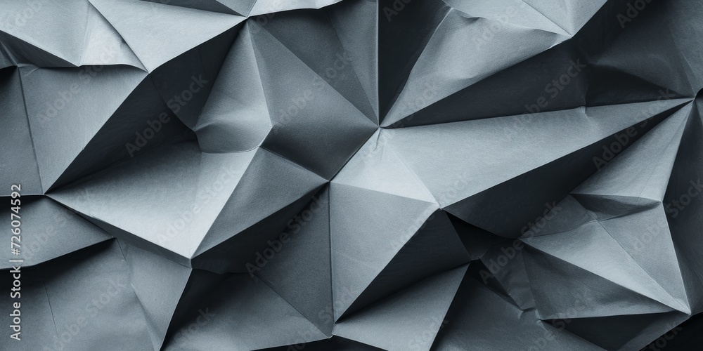 Abstract origami folds, with sharp, angular shapes in a monochromatic ...
