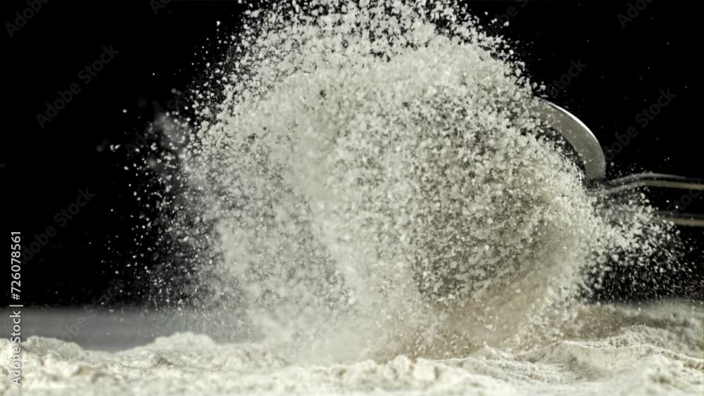 A sieve of flour falls on the kitchen table. Filmed on a high-speed camera at 1000 fps. High quality FullHD footage A sieve of flour falls on the kitchen table. Filmed on a high-speed camera at 1000 fps. High quality FullHD footage