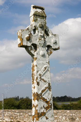 Celtic cross with Irish heart against blue sky and stone, Clonmacnoise, Ireland