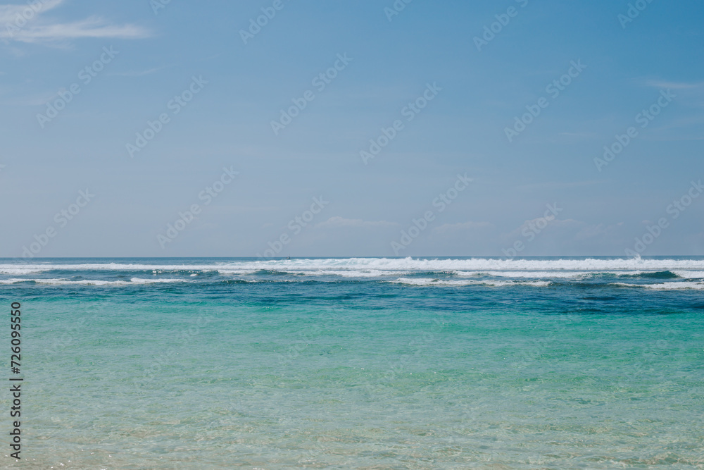 Clear blue ocean water. View from the beach to the sea. Travel and Leisure Concept
