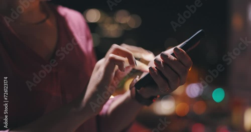 Woman, hands and phone in city at night to update social media, download digital app and scroll mobile notification. Closeup, outdoor and typing on smartphone, search online news and chat to contact photo