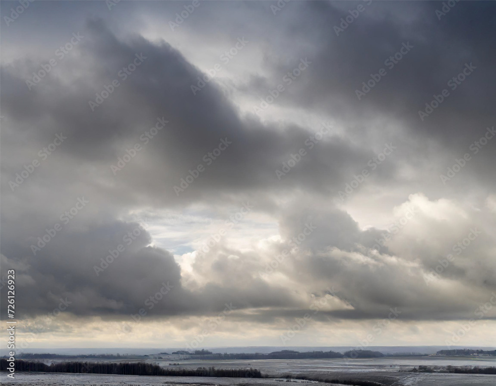 Fantastic winter landscape with snow covered field and dark stormy sky