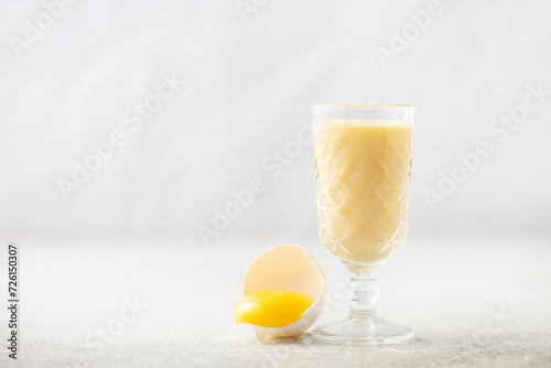 Egg alcohol liquor in a glass. Festive drink. photo