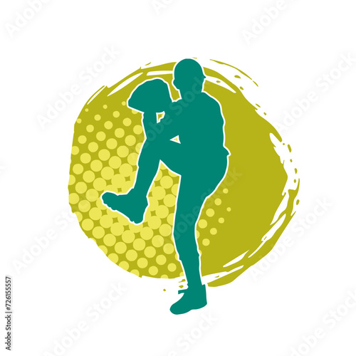 Silhouette of a baseball pitcher athlete ready to throw ball. Silhouette of male baseball pitcher in action pose.