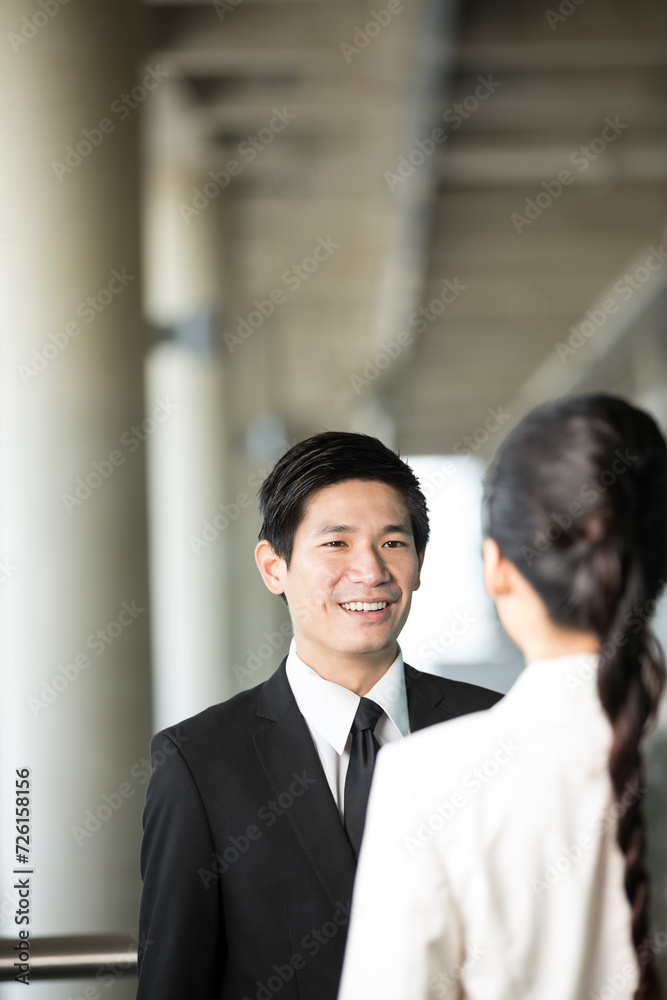 Asian Business colleagues talking Asian Business colleagues talking